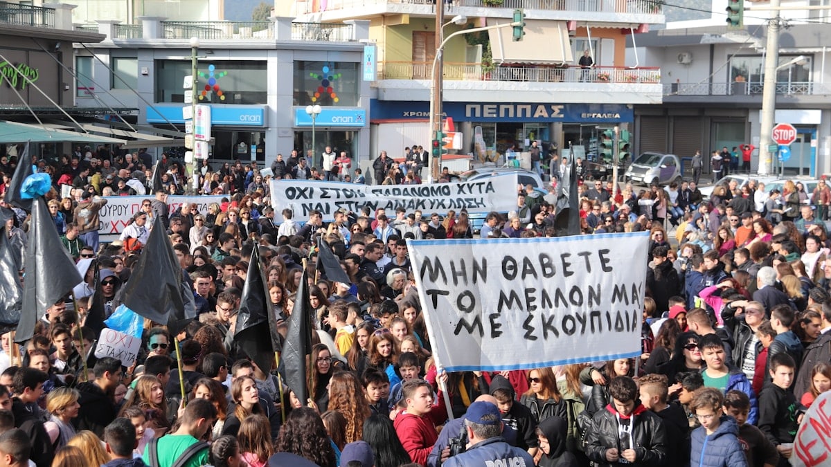 people gathered in the streets in a rally